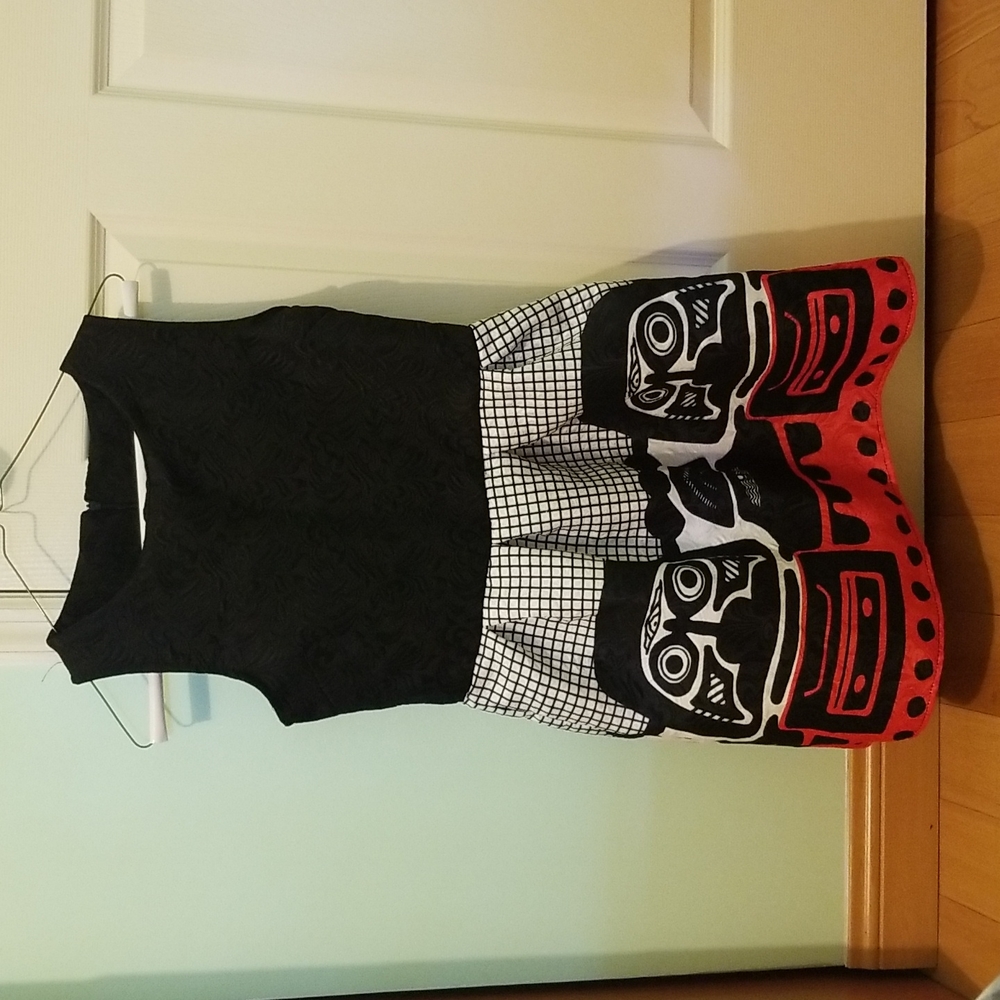 Black dress with daruma like design